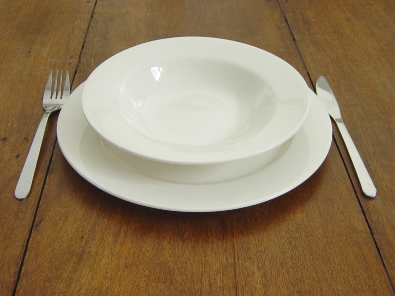 empty plate on wooden table