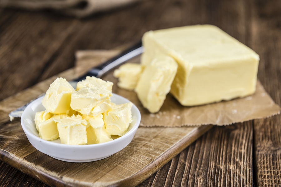 butter cubes on wooden background