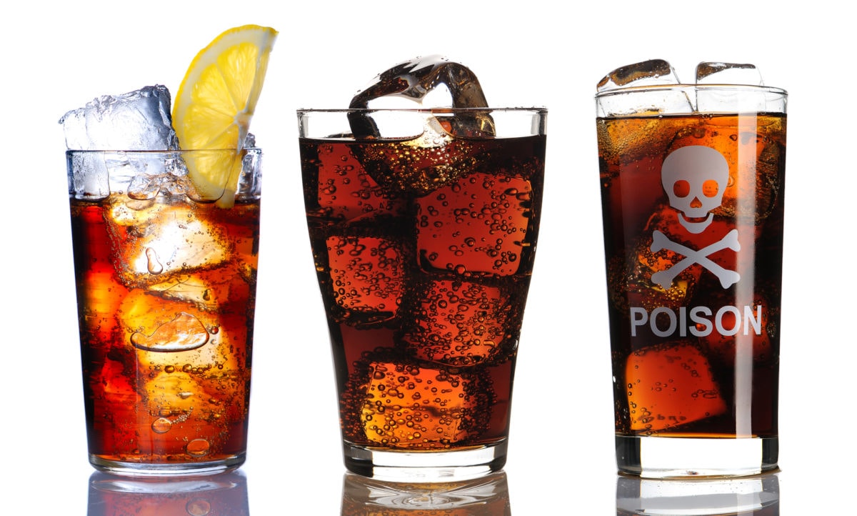 Cola or pepsi filled glasses with the word poison on one of the glasses