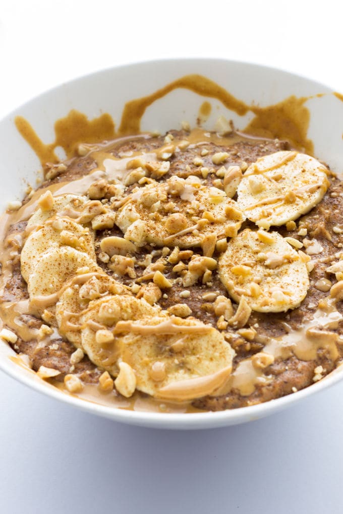 This Peanut Butter Porridge is easy to make, SO comforting and extra healthy! Vegan, Gluten-Free, Dairy-free | www.onecleverchef.com