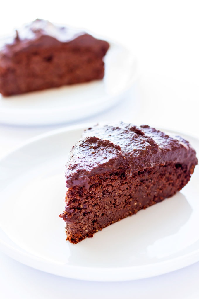 This healthy and decadent double chocolate chia cake is made of 100% real food ingredients. It is extra moist, rich and bursting with flavor. Easy to make, this delicious and versatile dessert is perfect for the novice baker. It is also paleo, gluten-free, eggless and flourless making, it the perfect guilt-free dessert or snack. With added protein, this recipe is also perfect as a post-workout treat. | www.onecleverchef.com