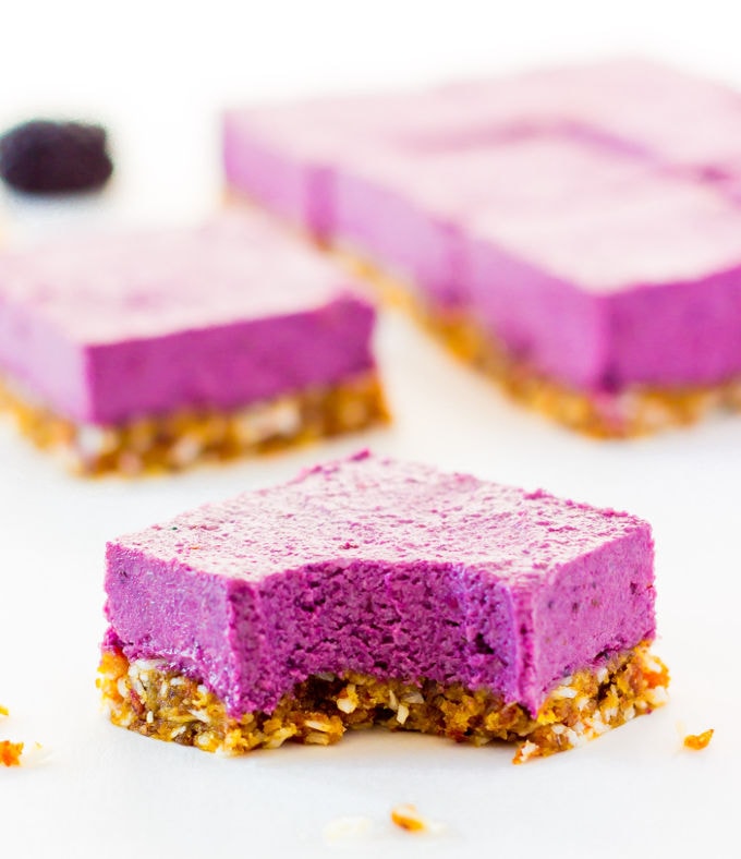 These Raw Vegan BlackBerry Cheesecake bars are super creamy and perfectly sweet. This easy no-bake dessert is also extremely healthy! You would never believe it's dessert by simply looking at the nutritional values. This recipe is also Paleo, Gluten-free, Egg-free, Flourless and Dairy-Free! | www.onecleverchef.com