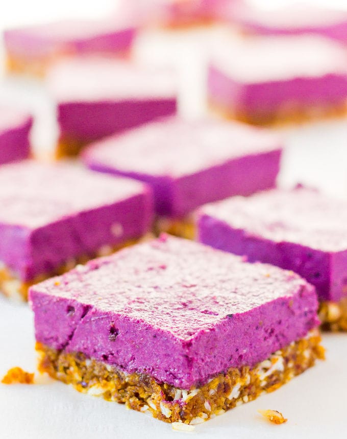 These Raw Vegan BlackBerry Cheesecake bars are super creamy and perfectly sweet. This easy no-bake dessert is also extremely healthy! You would never believe it's dessert by simply looking at the nutritional values. This recipe is also Paleo, Gluten-free, Egg-free, Flourless and Dairy-Free! | www.onecleverchef.com