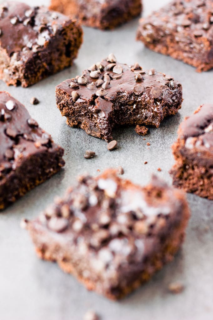 These rich and fudgy black bean protein brownies are the perfect post-workout treat! This super healthy snack is entirely flourless, gluten-free, vegan, dairy-free, egg-free, refined sugar-free and nut-free. Naturally sweetened with maple syrup and filled with antioxidants, these delicious brownie protein bars only require a few minutes of your time and a good food processor. | www.onecleverchef.com