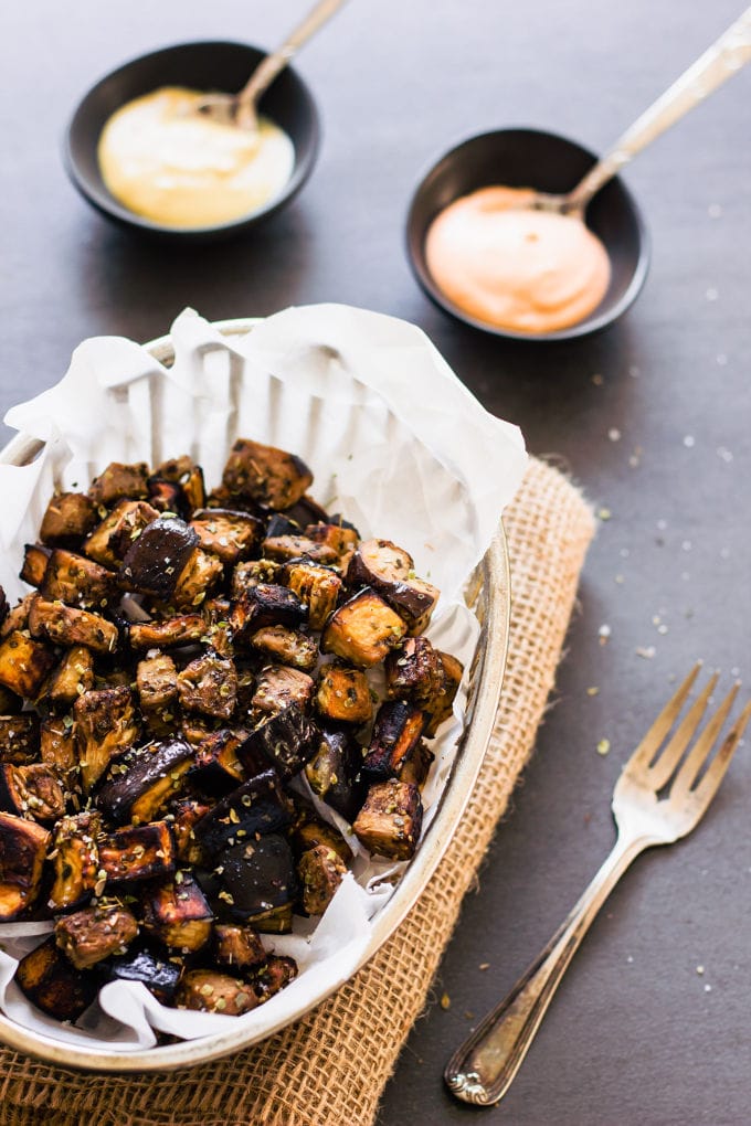 These oven roasted eggplant cubes are a delicious, much healthier alternative to potato fries. The recipe for the balsamic vinaigrette is of Mediterranean inspiration with strong Greek flavors. Super easy to make and 100% healthy, this recipe is also entirely paleo, gluten-free, vegan, low-carb, dairy-free, flourless, nut-free and egg-free. | www.onecleverchef.com