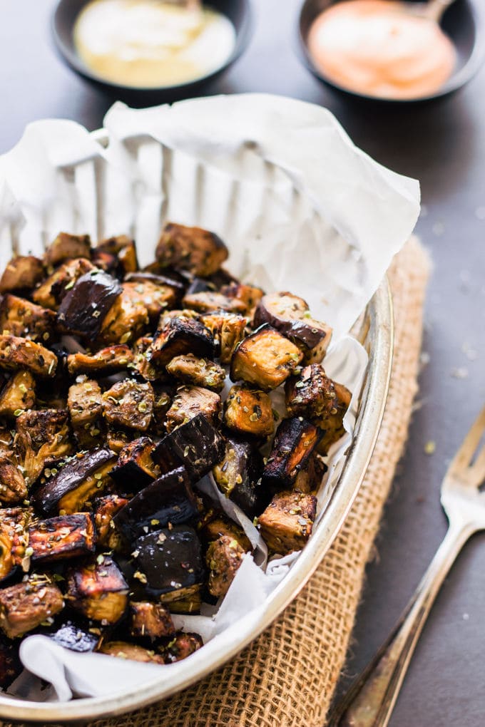 These oven roasted eggplant cubes are a delicious, much healthier alternative to potato fries. The recipe for the balsamic vinaigrette is of Mediterranean inspiration with strong Greek flavors. Super easy to make and 100% healthy, this recipe is also entirely paleo, gluten-free, vegan, low-carb, dairy-free, flourless, nut-free and egg-free. | www.onecleverchef.com