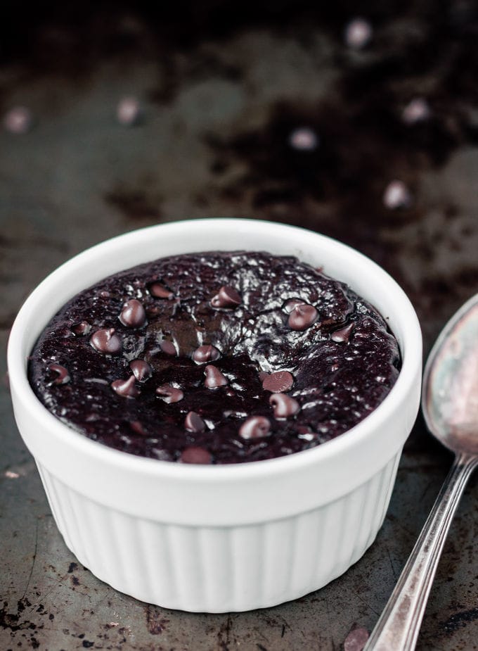 You can have this healthy, delicious and fudgy 3 ingredient chocolate protein mug cake ready within the next 2 minutes. Wait! What?! That's right. This easy, one bowl (or mug) chocolate protein cake is super easy to make. All you need to make this decadent, moist, gooey and protein-packed treat is a fork, a bowl, and a microwave! For a molten lava chocolate cake version, simply reduce the baking time slightly. Entirely Paleo, vegan, gluten-free, dairy-free, nut-free, egg-free,  flourless and kid-friendly! Chocolate cake for breakfast? Yes, YES! (Oven option available) | www.onecleverchef.com