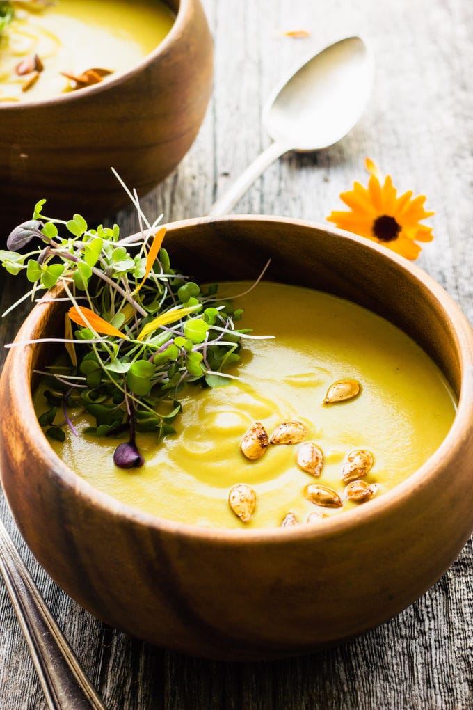 This easy and healthy curried acorn squash soup is the perfect fall comfort food. Sweet and spicy, creamy and savory, this simple potage is also vegan, gluten-free, dairy-free, paleo, vegetarian, flourless, nut-free and sugar-free. | www.onecleverchef.com