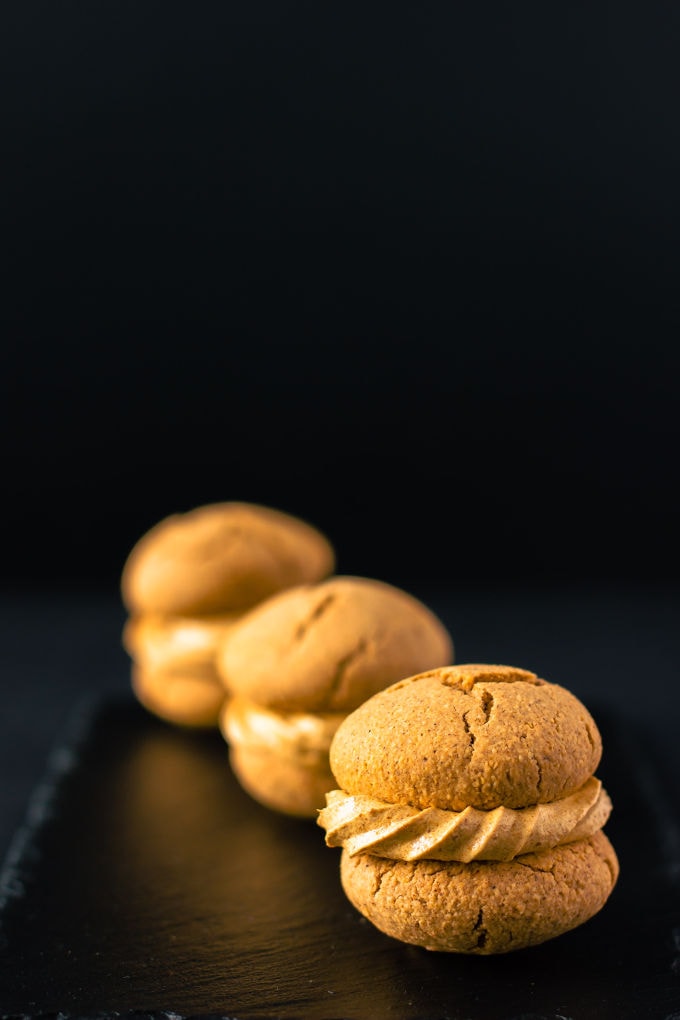 Apple Pie Flavored Vegan Protein Cookies with a salted caramel filling! Healthy, simple and naturally sweetened. Vegan, gluten-free, dairy-free and egg-free recipe. | onecleverchef.com