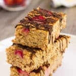 These healthy strawberry protein bars are made with only 5 ingredients. Convenient and quick, this delicious snack packs a lot of nutrients and is guaranteed to fill you up until lunch on a busy day. Vegan, Gluten-Free, Dairy-free and flourless these bars are friendly to most popular diet trends.