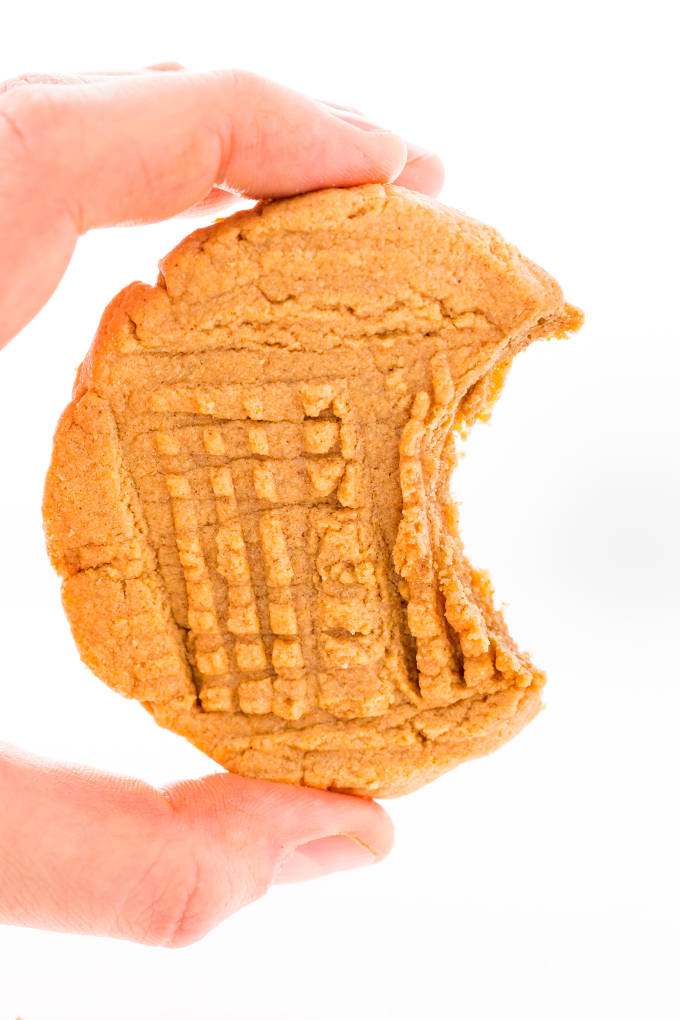 Peanut butter protein cookies held by a hand.