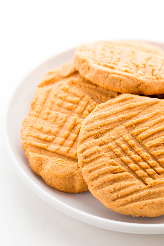 Peanut butter protein cookies on a white plate.