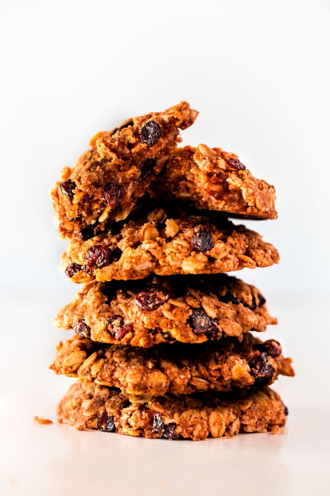 Vegan oatmeal raisin cookies piled up.