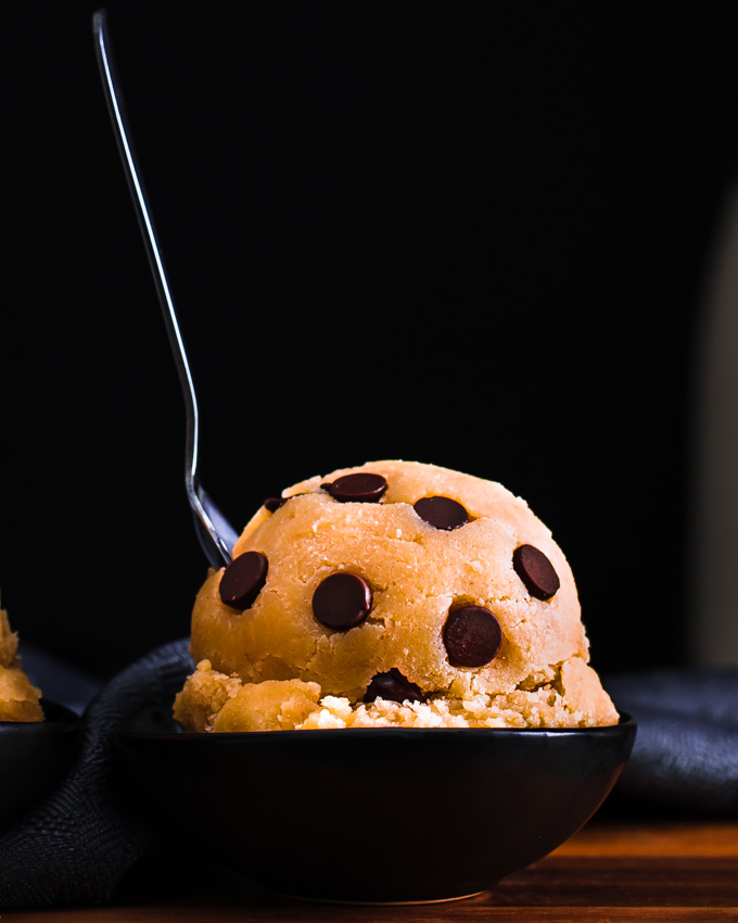 1 Edible cookie dough balls on a wooden board.