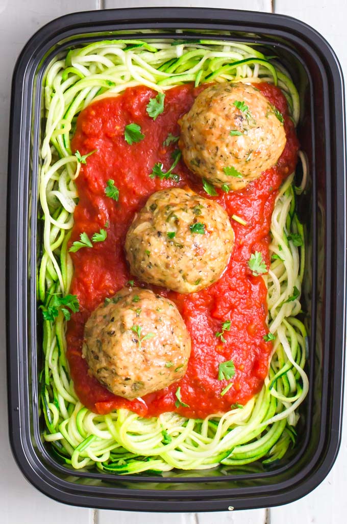 Whole30 turkey meatballs on zucchini noodles and marinara sauce. Closeup shot.