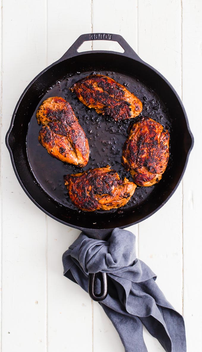 Cooked chicken breasts in a cast iron pan