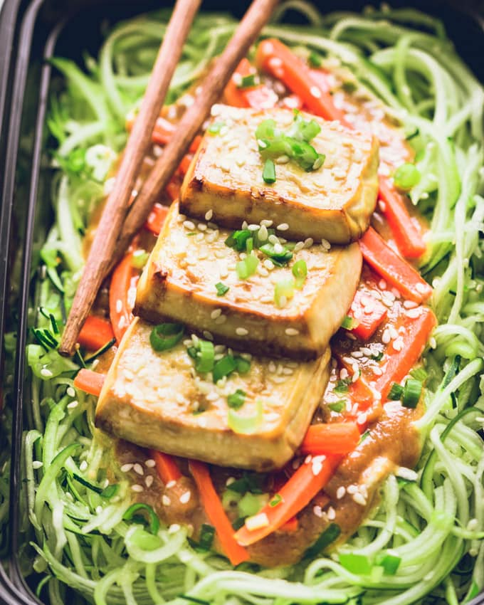 One Vegan Peanut Butter Tofu on Zoodles serving in a meal prep container