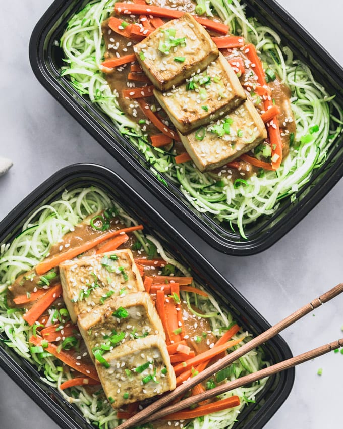 Two Vegan Peanut Butter Tofu on Zoodles servings in meal prep containers