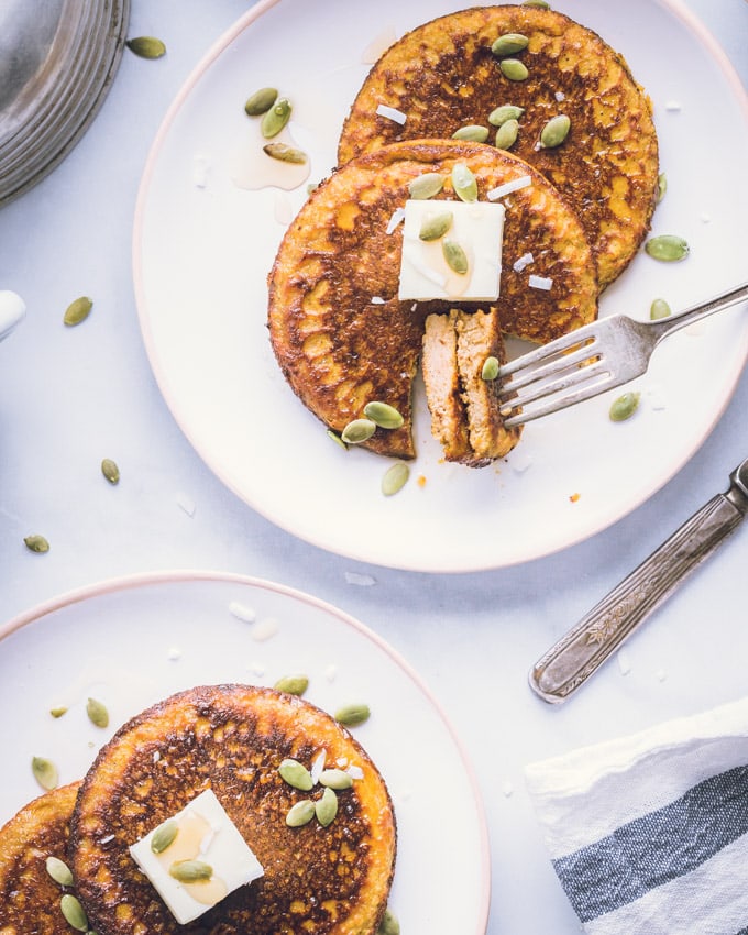 Four Pumpkin Protein Pancakes on two separate plates