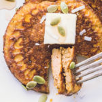 Two bites of Pumpkin Protein Pancakes planted on a fork