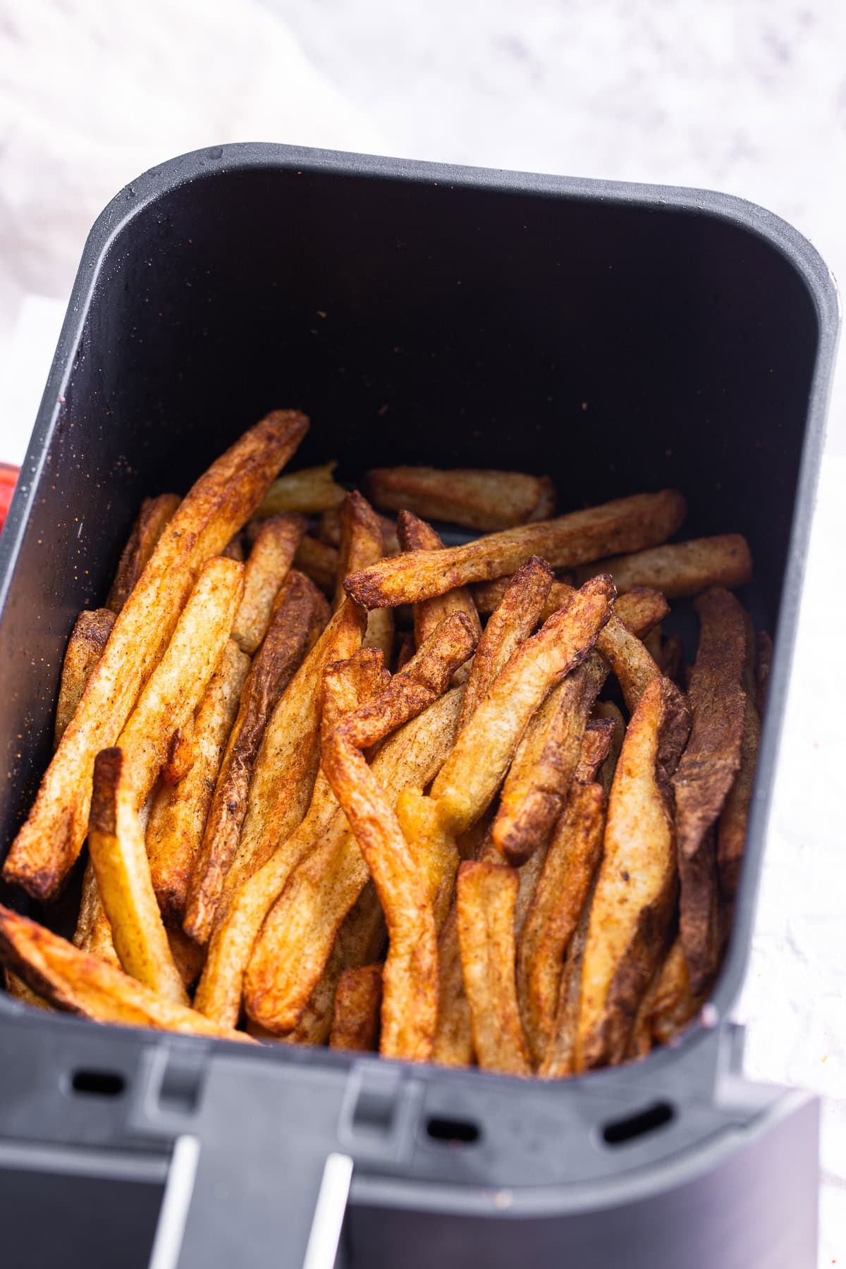 Air Fryer Steak Fries in a air fryer basket